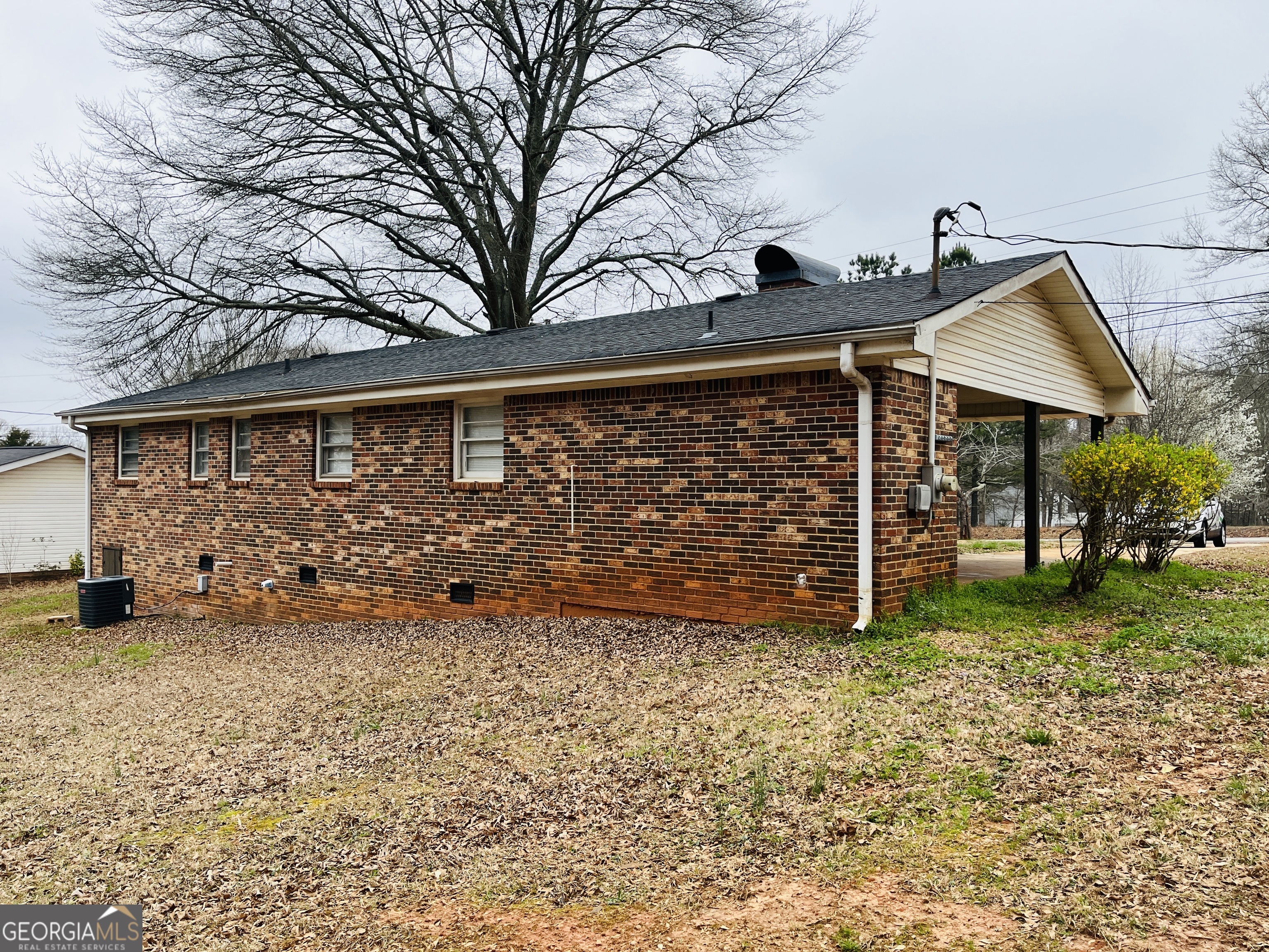 1085 Horsley Mill Road Carrollton, GA 30116 - Photo 26 of 26 a view of a backyard with wooden fence and a bench