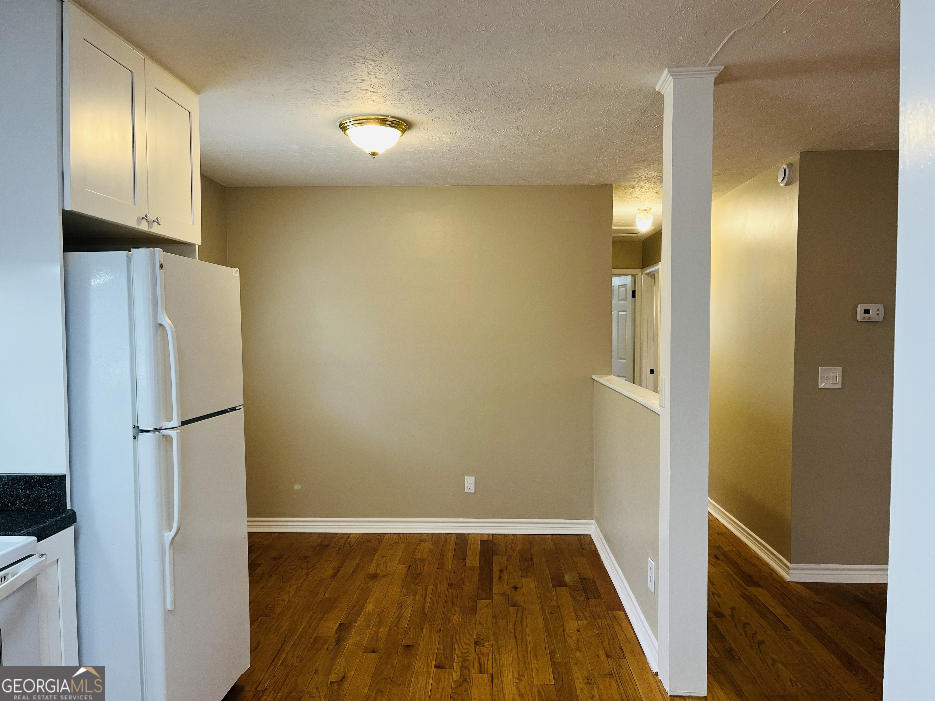 1085 Horsley Mill Road Carrollton, GA 30116 - Photo 10 of 26 a view of a hallway with wooden floor