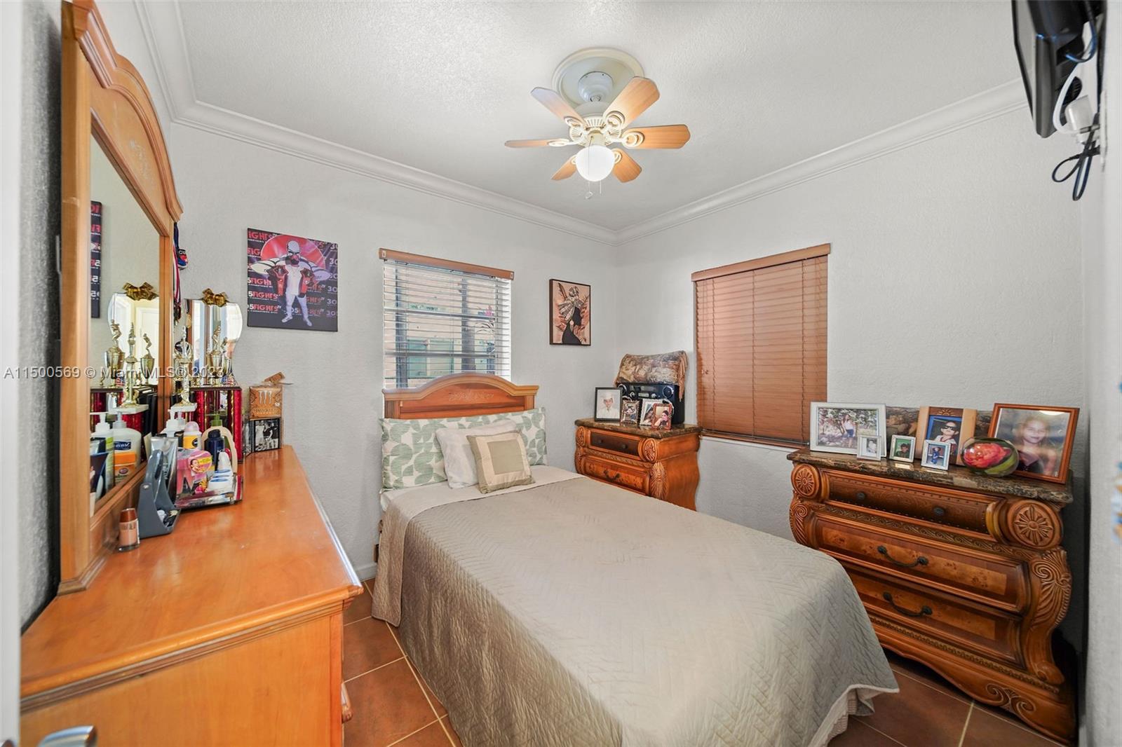 1828 Southwest 6th Street Miami, FL 33135 - Photo 11 of 50 a bedroom with a bed and a chandelier