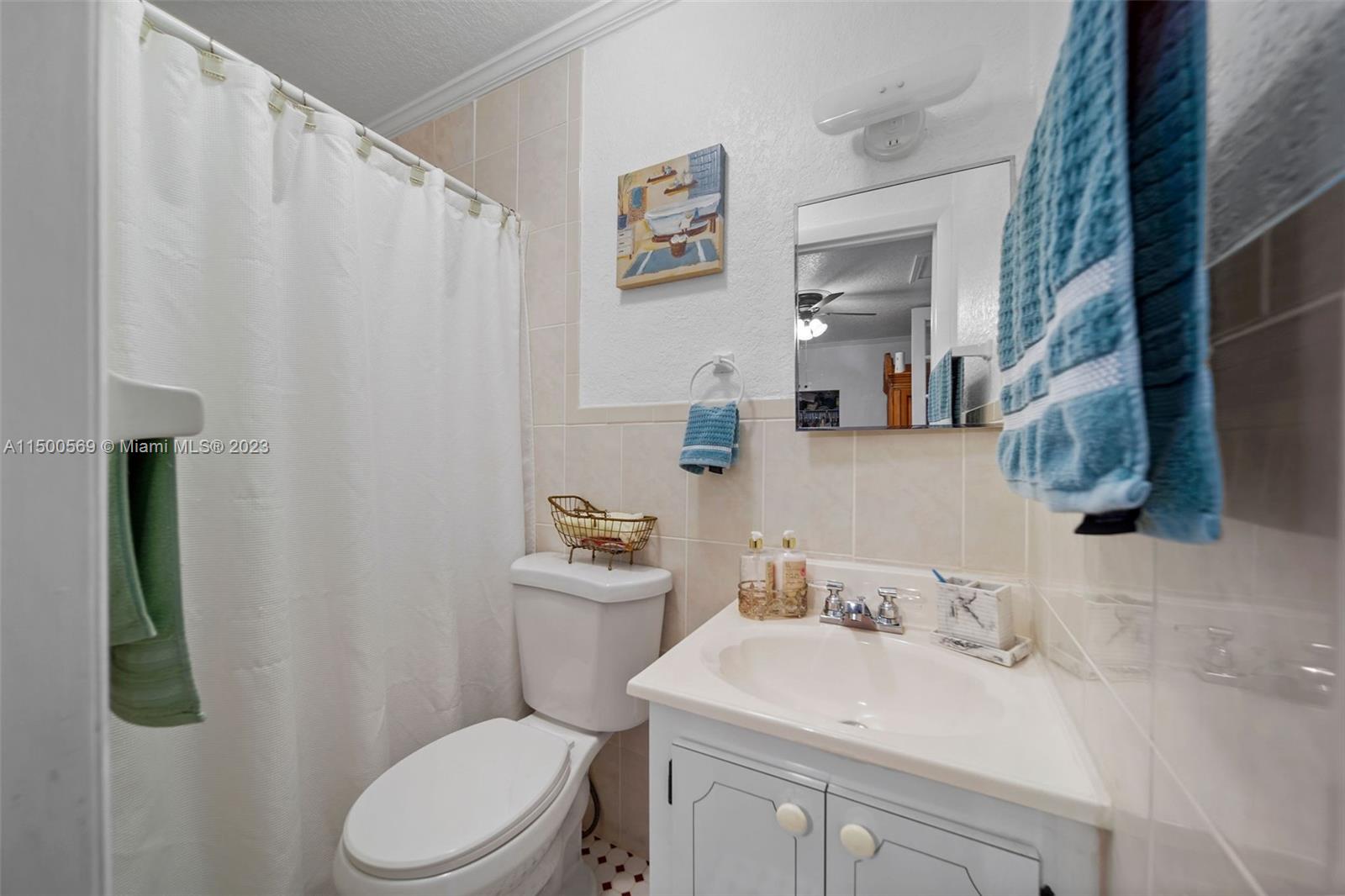 1828 Southwest 6th Street Miami, FL 33135 - Photo 15 of 50 a bathroom with a sink vanity mirror and toilet