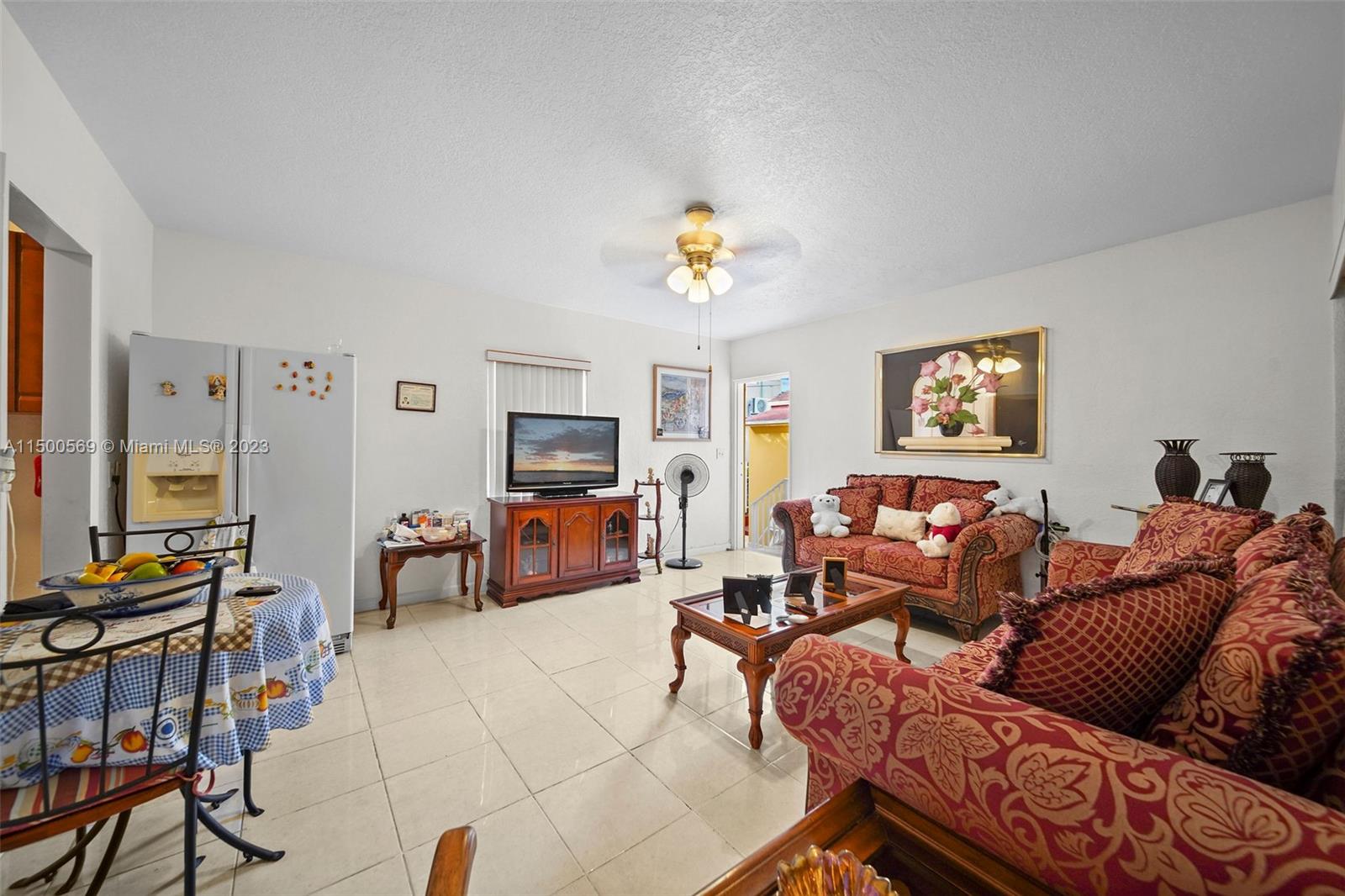 1828 Southwest 6th Street Miami, FL 33135 - Photo 17 of 50 a living room with furniture a fireplace and a flat screen tv