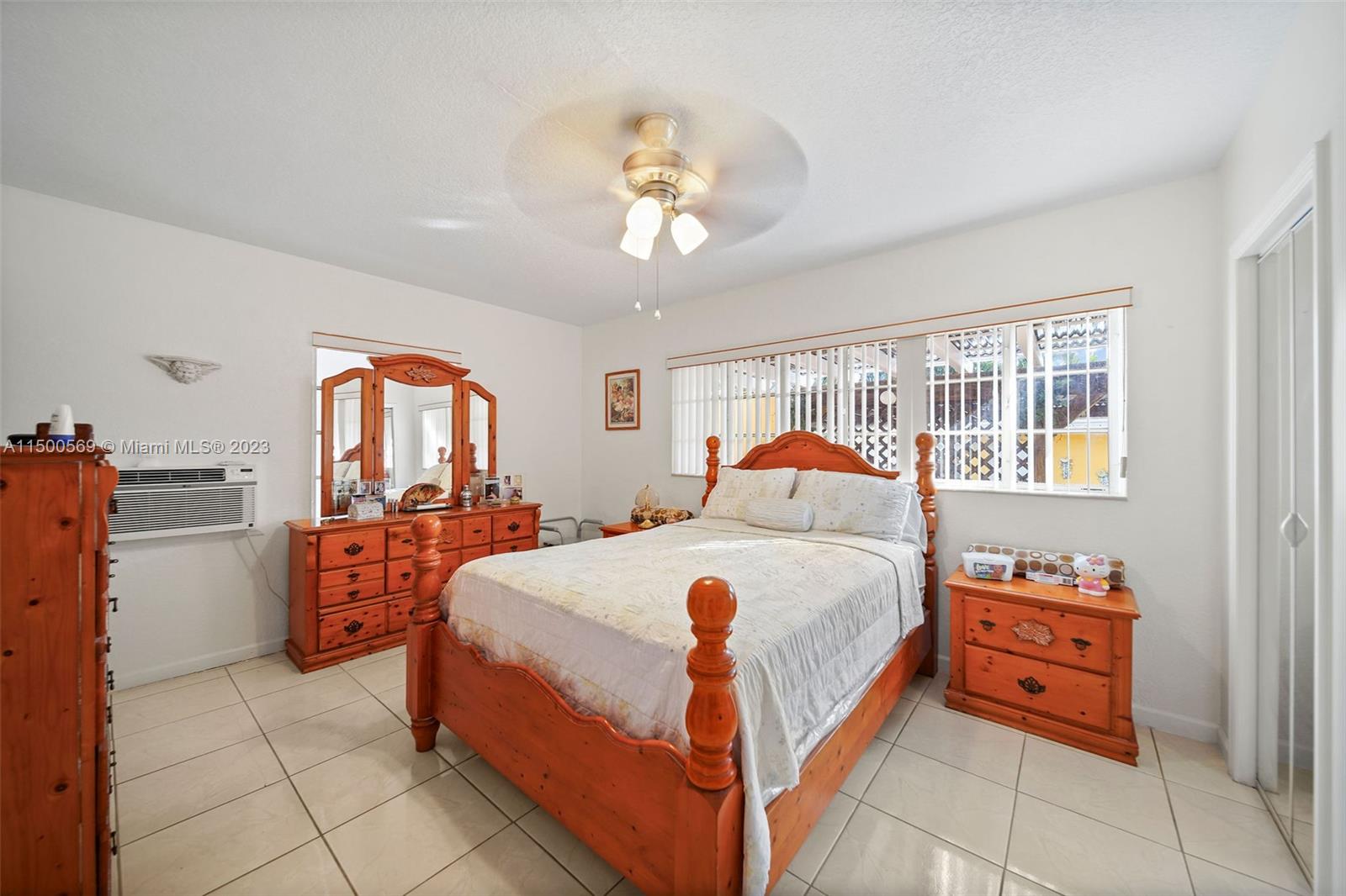1828 Southwest 6th Street Miami, FL 33135 - Photo 21 of 50 a bed room with a bed and a chandelier