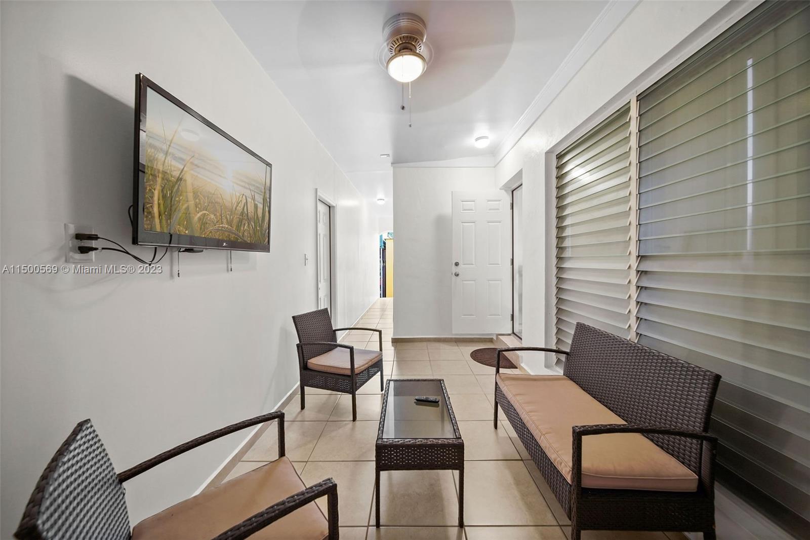 1828 Southwest 6th Street Miami, FL 33135 - Photo 23 of 50 a living room with furniture and a flat screen tv