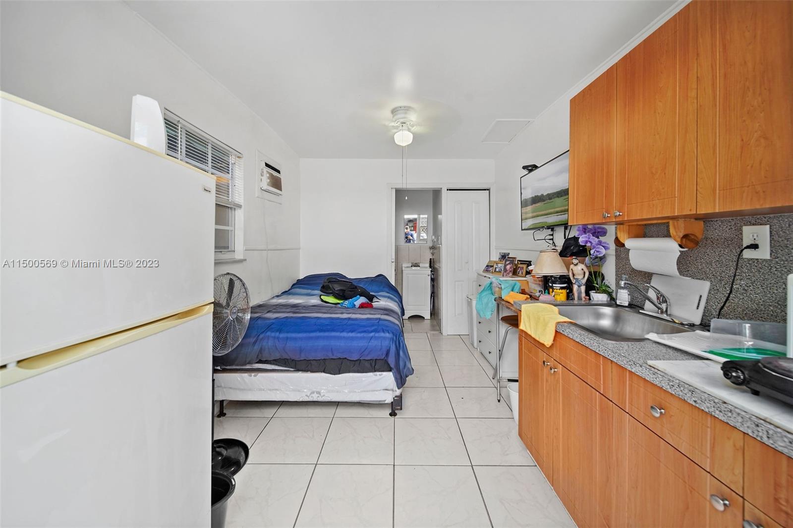 1828 Southwest 6th Street Miami, FL 33135 - Photo 28 of 50 a kitchen with stainless steel appliances a sink stove and cabinets