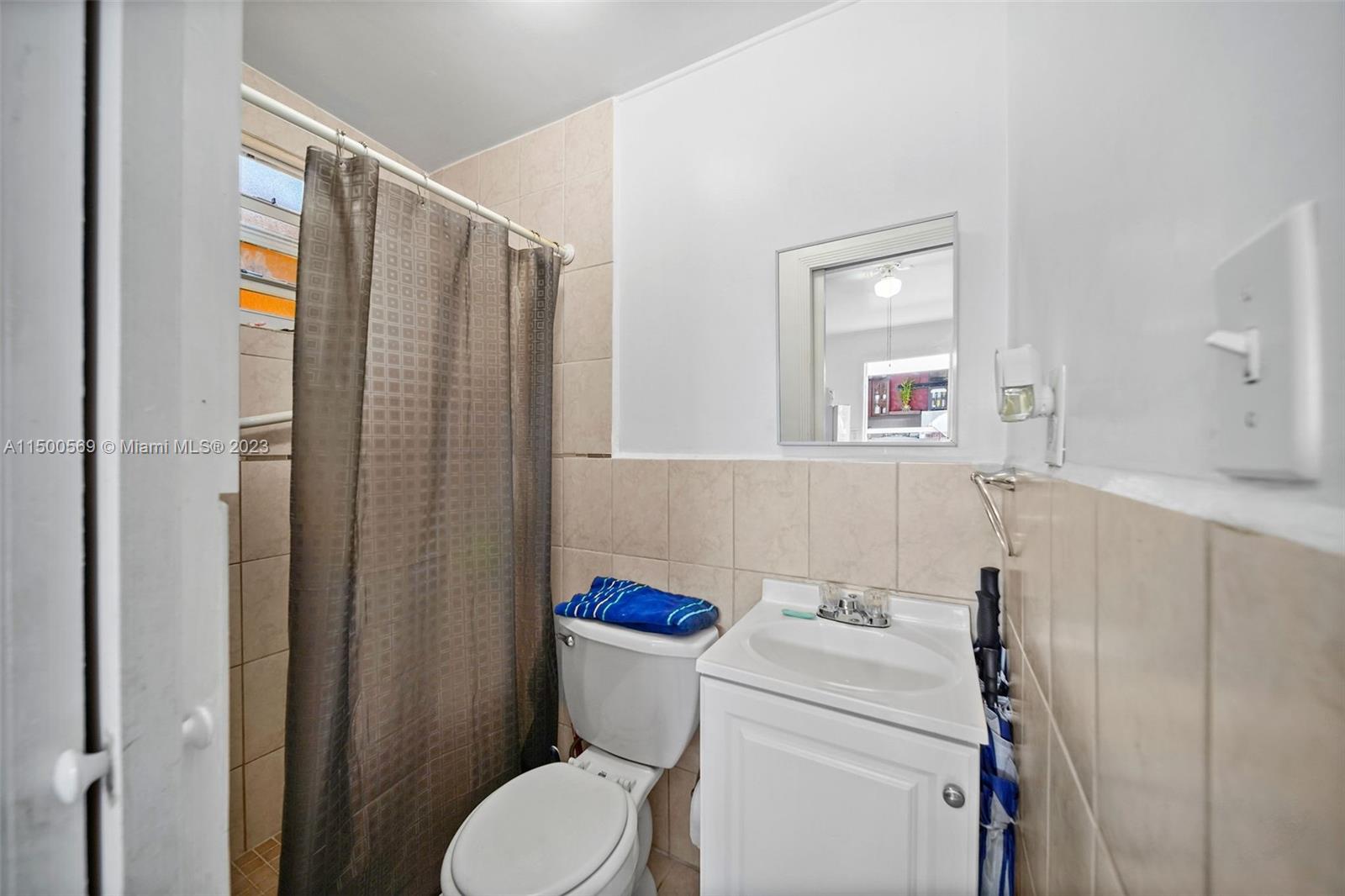 1828 Southwest 6th Street Miami, FL 33135 - Photo 30 of 50 a bathroom with a sink a toilet and shower