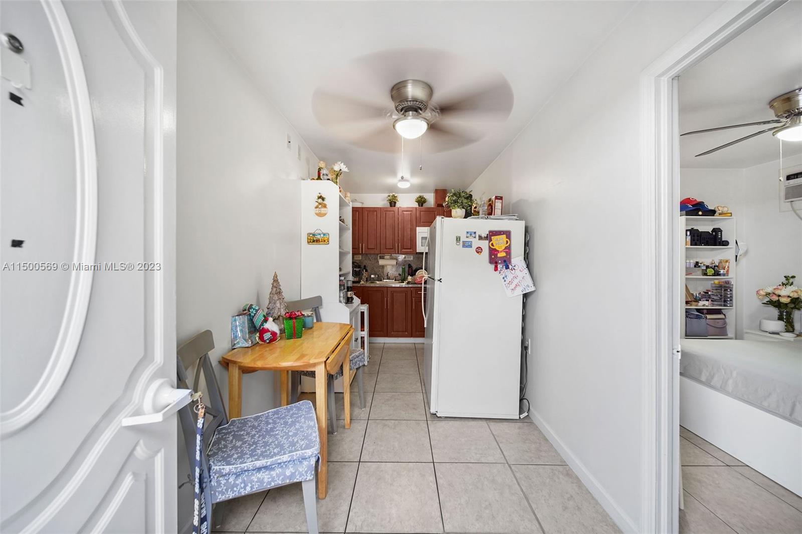 1828 Southwest 6th Street Miami, FL 33135 - Photo 32 of 50 a view of a dining room with furniture and a chandelier