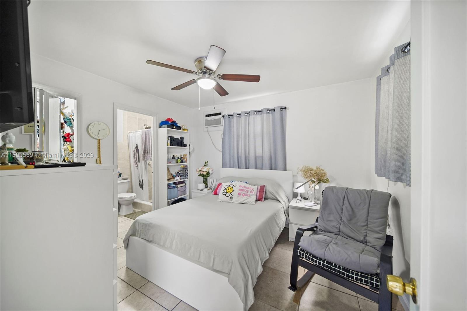 1828 Southwest 6th Street Miami, FL 33135 - Photo 33 of 50 a bedroom with a bed couch and a window