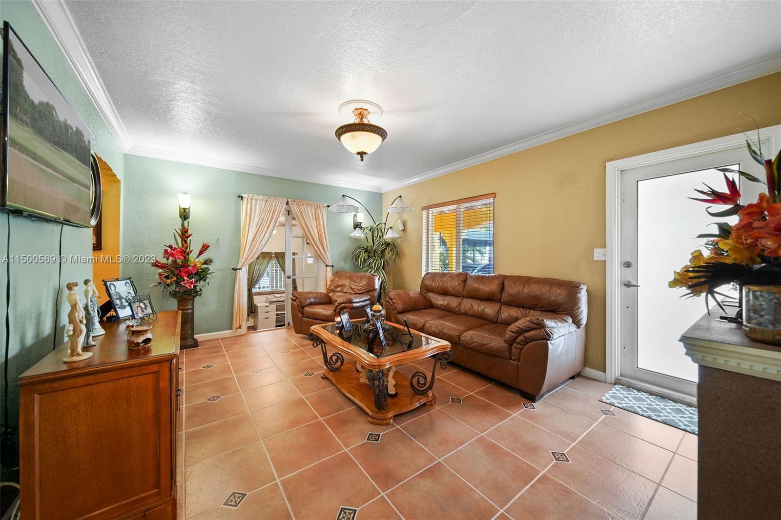 1828 Southwest 6th Street Miami, FL 33135 - Photo 4 of 50 a living room with furniture and a flat screen tv