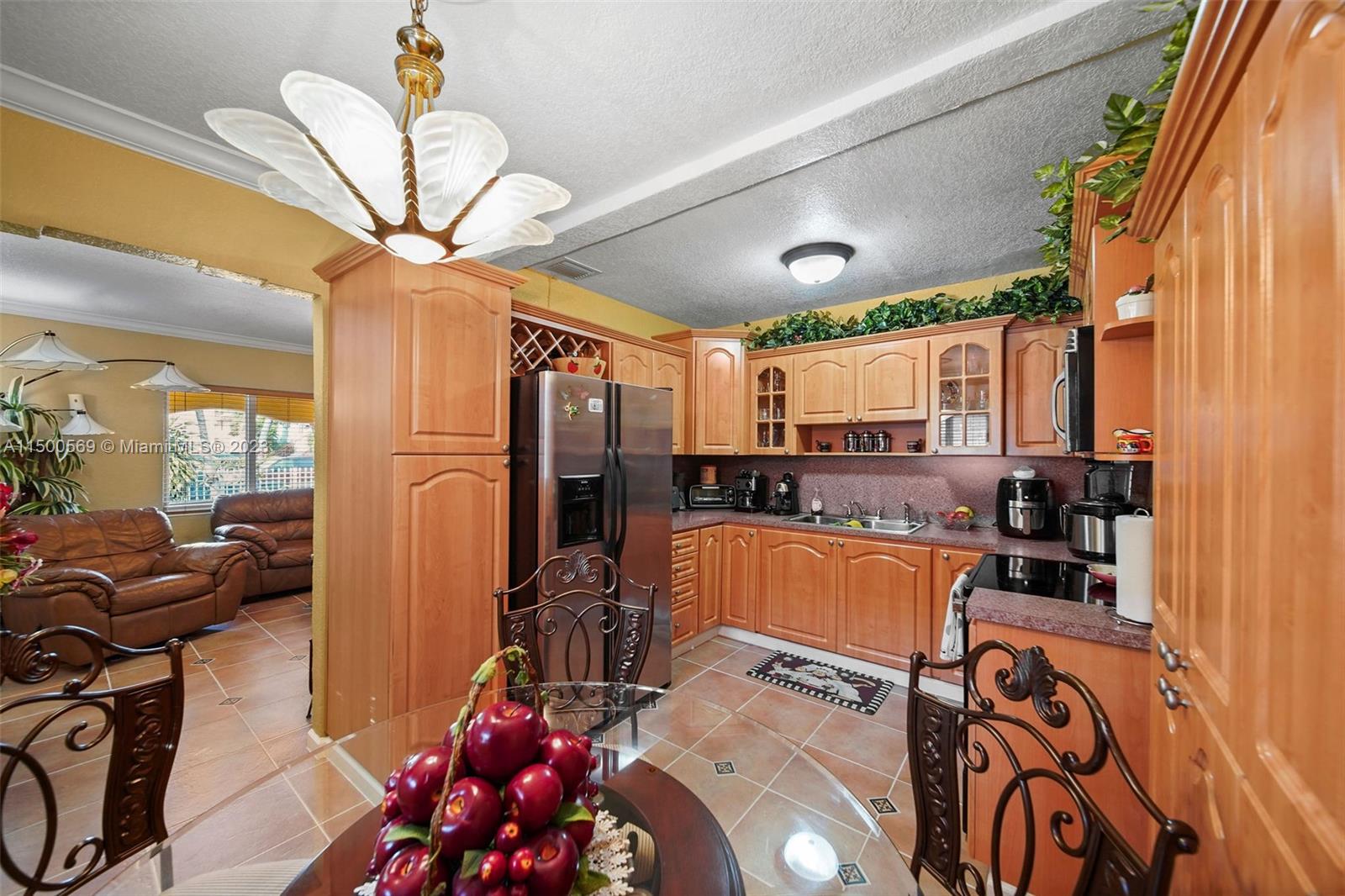 1828 Southwest 6th Street Miami, FL 33135 - Photo 9 of 50 a living room with furniture a chandelier and a window