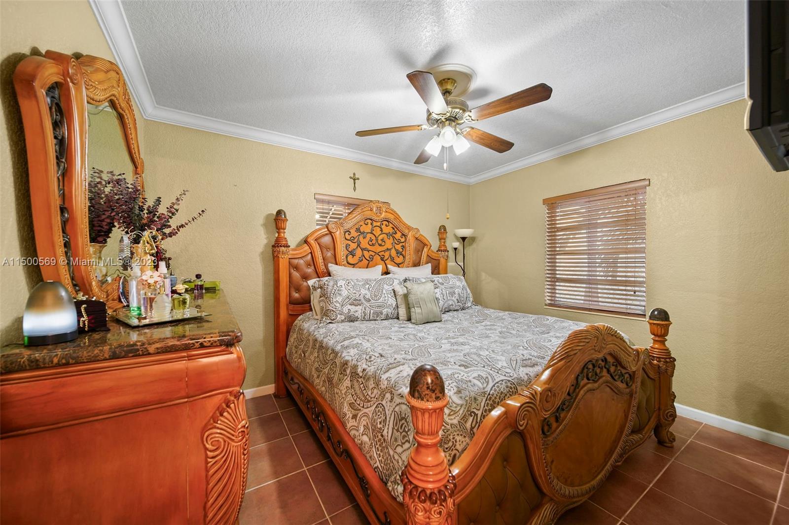 1828 Southwest 6th Street Miami, FL 33135 - Photo 10 of 50 a bedroom with a bed and dresser with wooden floor