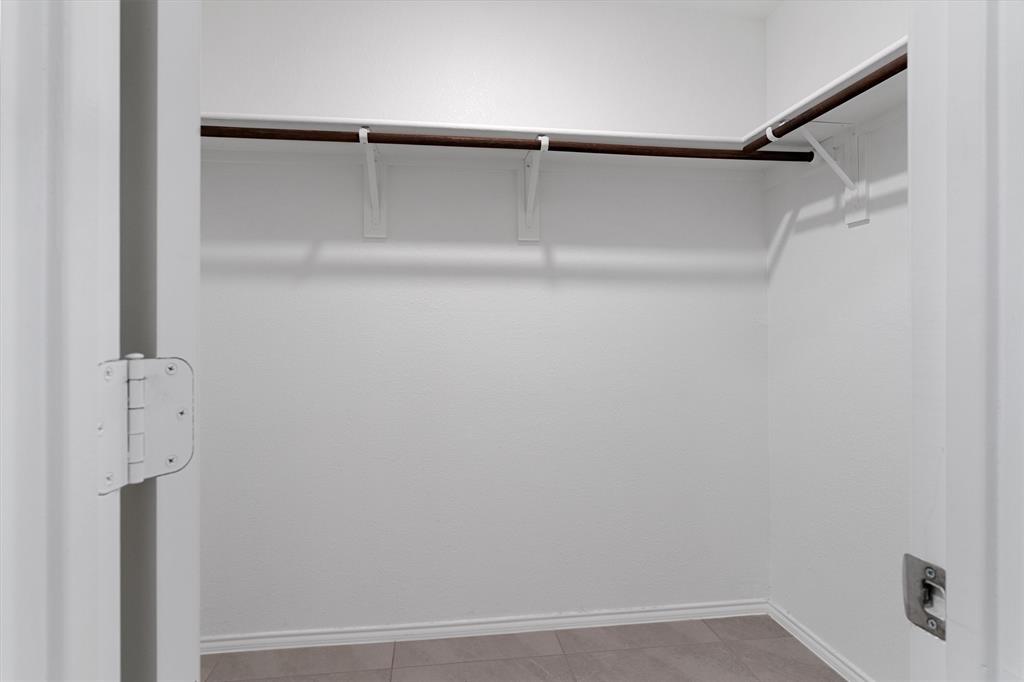 7781 Ruellia Road McKinney, TX 75071 - Photo 16 of 25 Spacious closet with tile patterned flooring