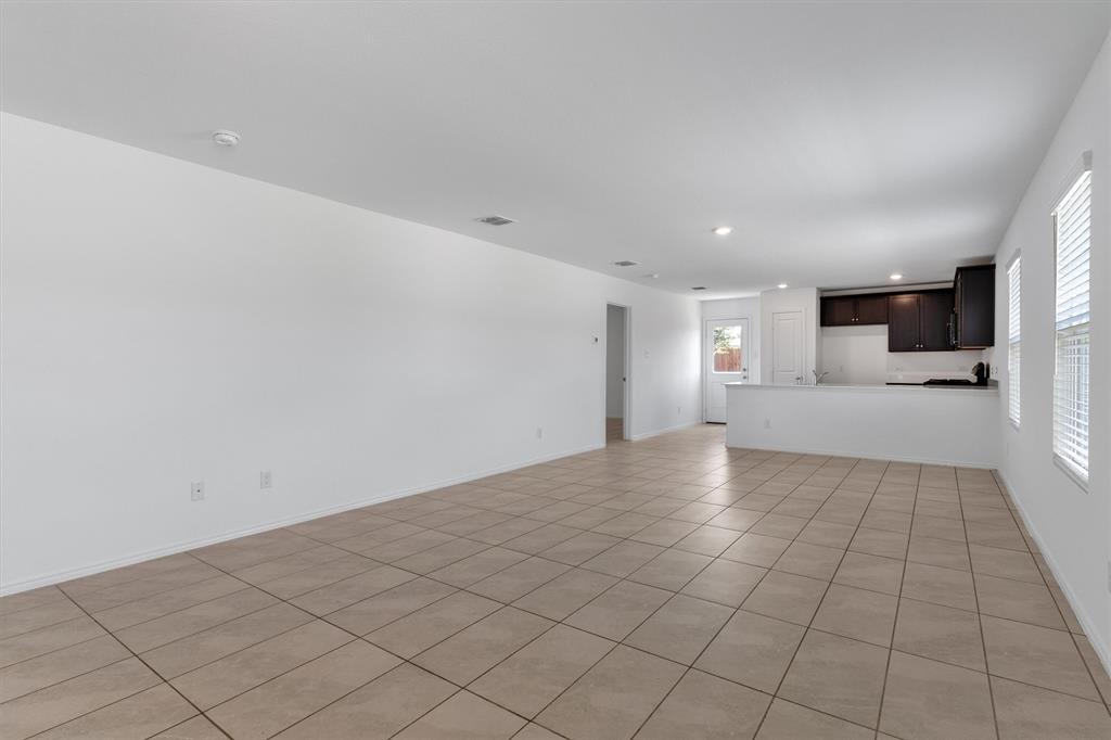 7781 Ruellia Road McKinney, TX 75071 - Photo 6 of 25 Unfurnished living room featuring light tile patterned floors and recessed lighting