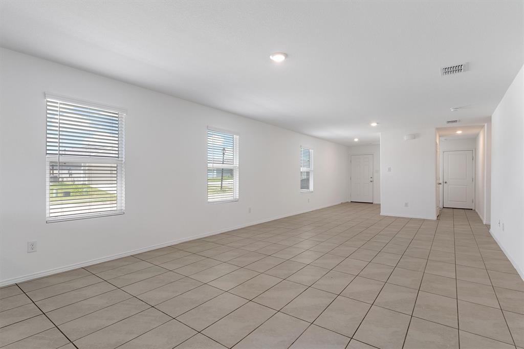 7781 Ruellia Road McKinney, TX 75071 - Photo 7 of 25 Spare room featuring recessed lighting and light tile patterned flooring