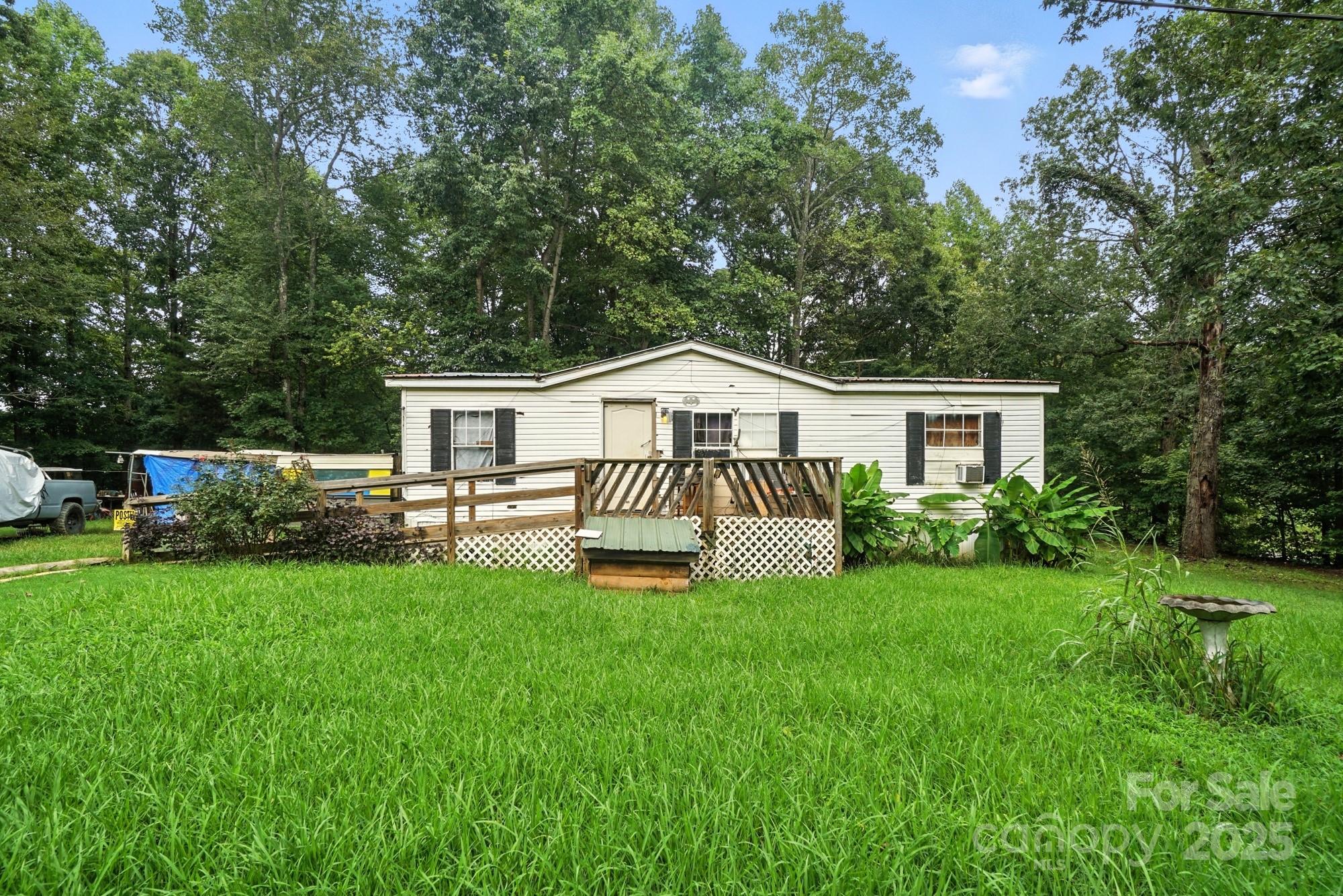 450 Dixon School Road Kings Mountain, NC 28086 - Photo 20 of 22 a house view with a garden and deck