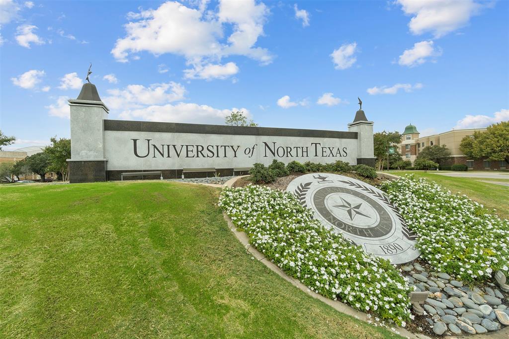 7014 Butterfield Drive Sanger, TX 76266 - Photo 9 of 11 a sign of golf club on a wall under a tree