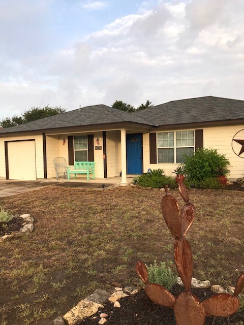 206 Summit Ridge Drive North Point Venture, TX 78645 - Photo 1 of 1 a front view of a house with garden