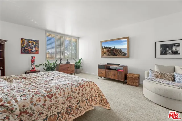 a bed room with a bed and a couch