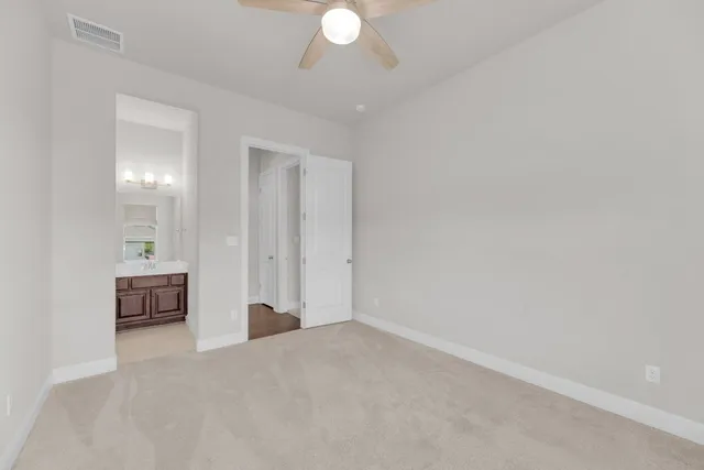 a view of an empty room with a mirror