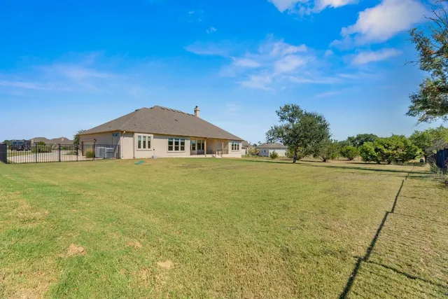 a blue swimming pool is in the middle of a lake