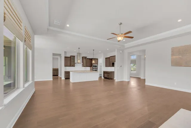 a view of kitchen with furniture and wooden floor