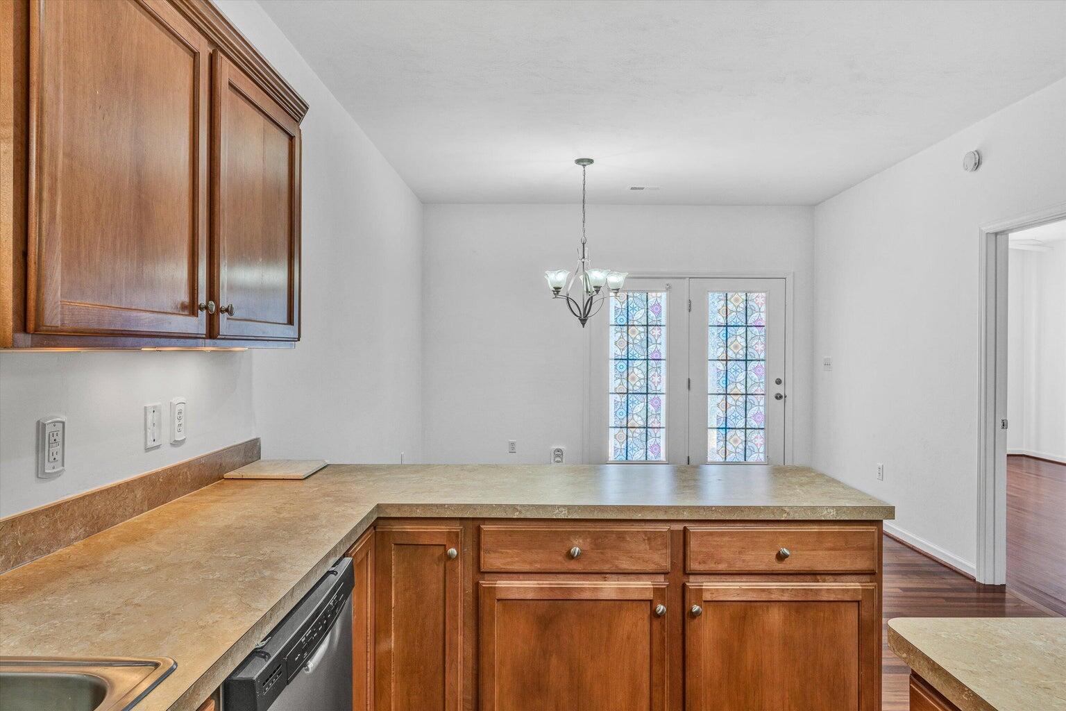 88 Maple Street Salem, VA 24153 - Photo 11 of 25 a kitchen with stainless steel appliances granite countertop a sink and a refrigerator