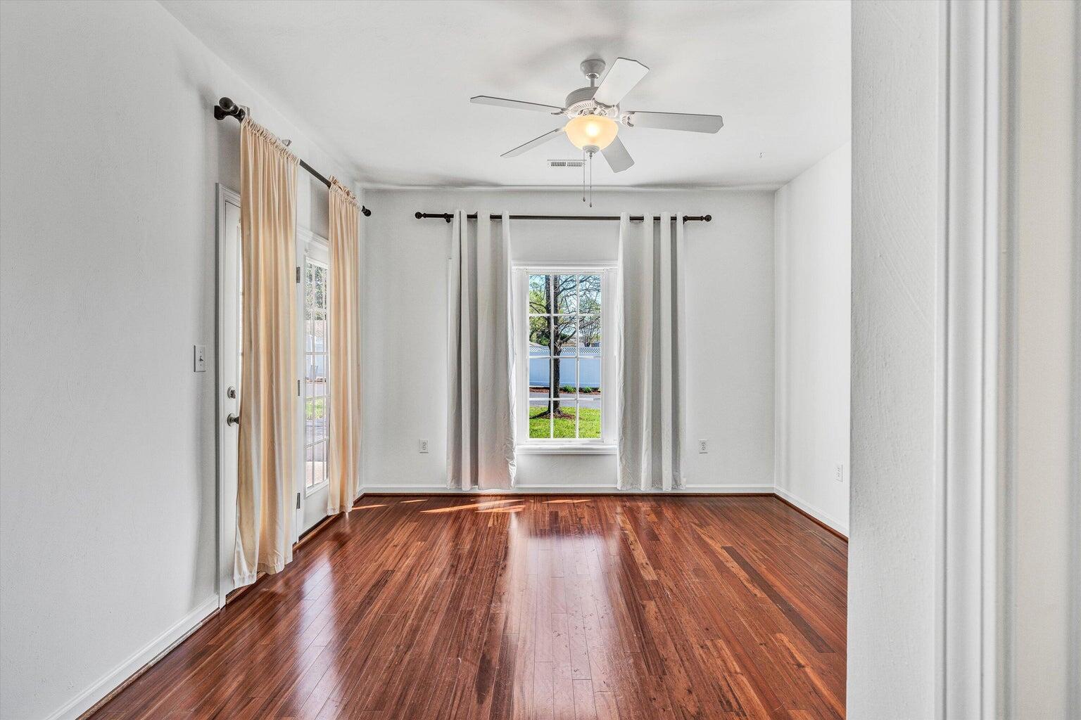 88 Maple Street Salem, VA 24153 - Photo 13 of 25 a view of an empty room with wooden floor and a window