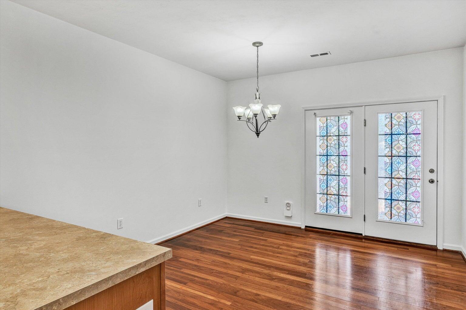 88 Maple Street Salem, VA 24153 - Photo 14 of 25 a view of empty room with wooden floor and fan