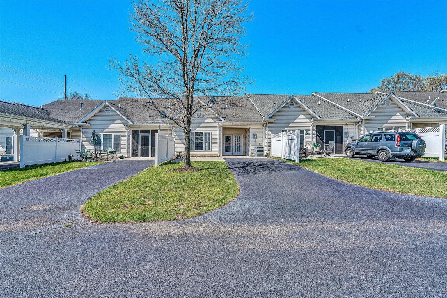88 Maple Street Salem, VA 24153 - Photo 23 of 25 a front view of a house with a garden and plants
