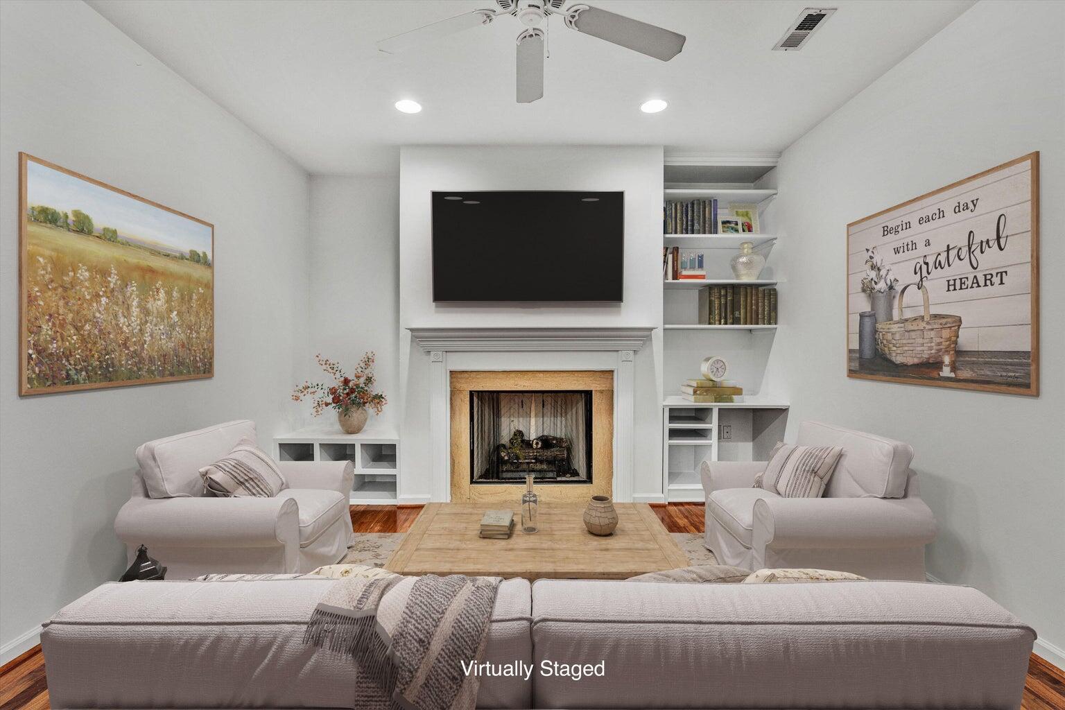 88 Maple Street Salem, VA 24153 - Photo 25 of 25 a living room with furniture a flat screen tv and a fireplace