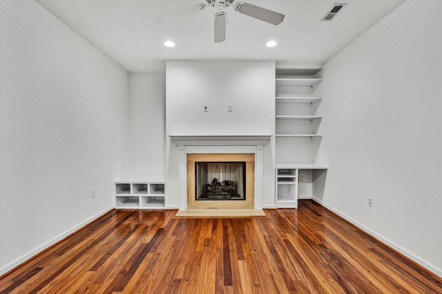88 Maple Street Salem, VA 24153 - Photo 5 of 25 a view of an empty room with wooden floor fireplace and a window