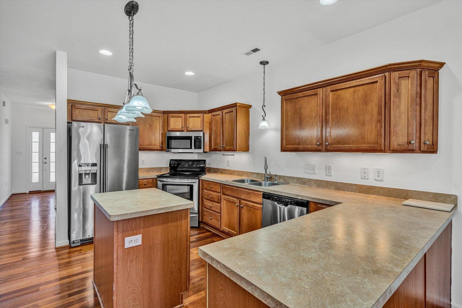 88 Maple Street Salem, VA 24153 - Photo 10 of 25 a kitchen with stainless steel appliances granite countertop a sink a stove and a refrigerator