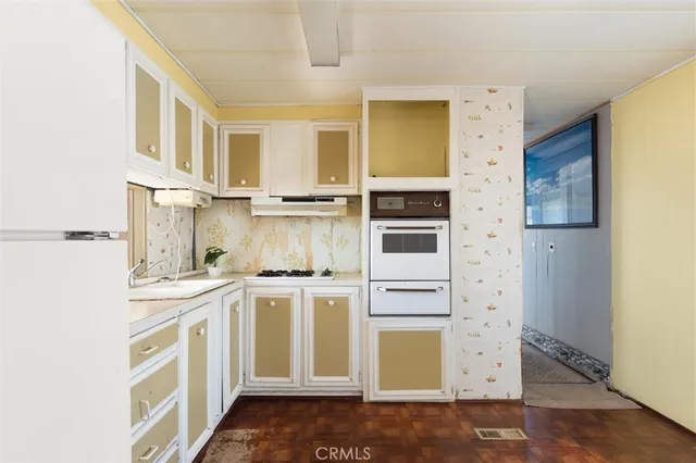 a view of a bathroom with wooden floor and a window