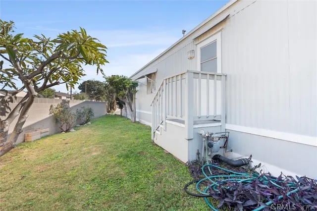 a view of a backyard with potted plants