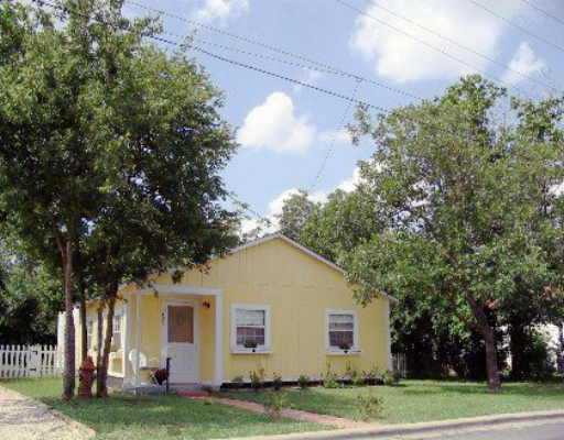 405 East 19th Street Georgetown, TX 78626 - Photo 1 of 1 a view of a yard in front of a house