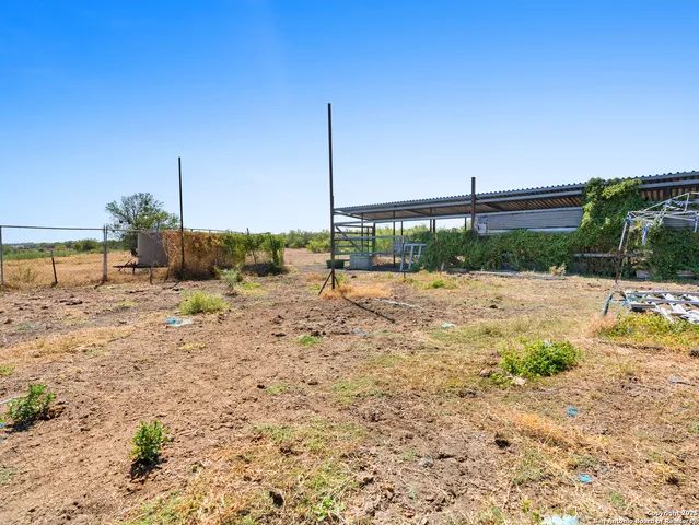 a view of a backyard of the house