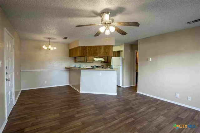 a view of a kitchen with a sink and cabinet area