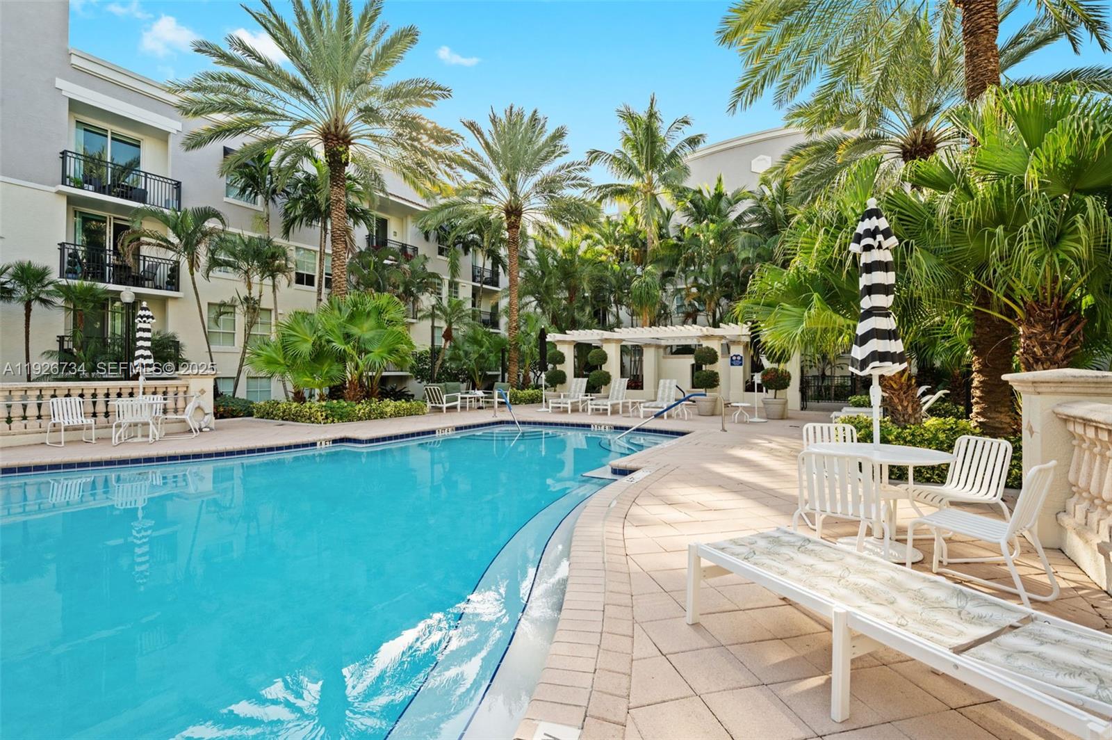 600 South Dixie Highway, Unit 237 West Palm Beach, FL 33401 - Photo 23 of 46 a view of a swimming pool with a patio