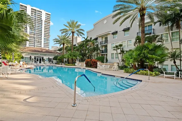a buildings covered with tall trees
