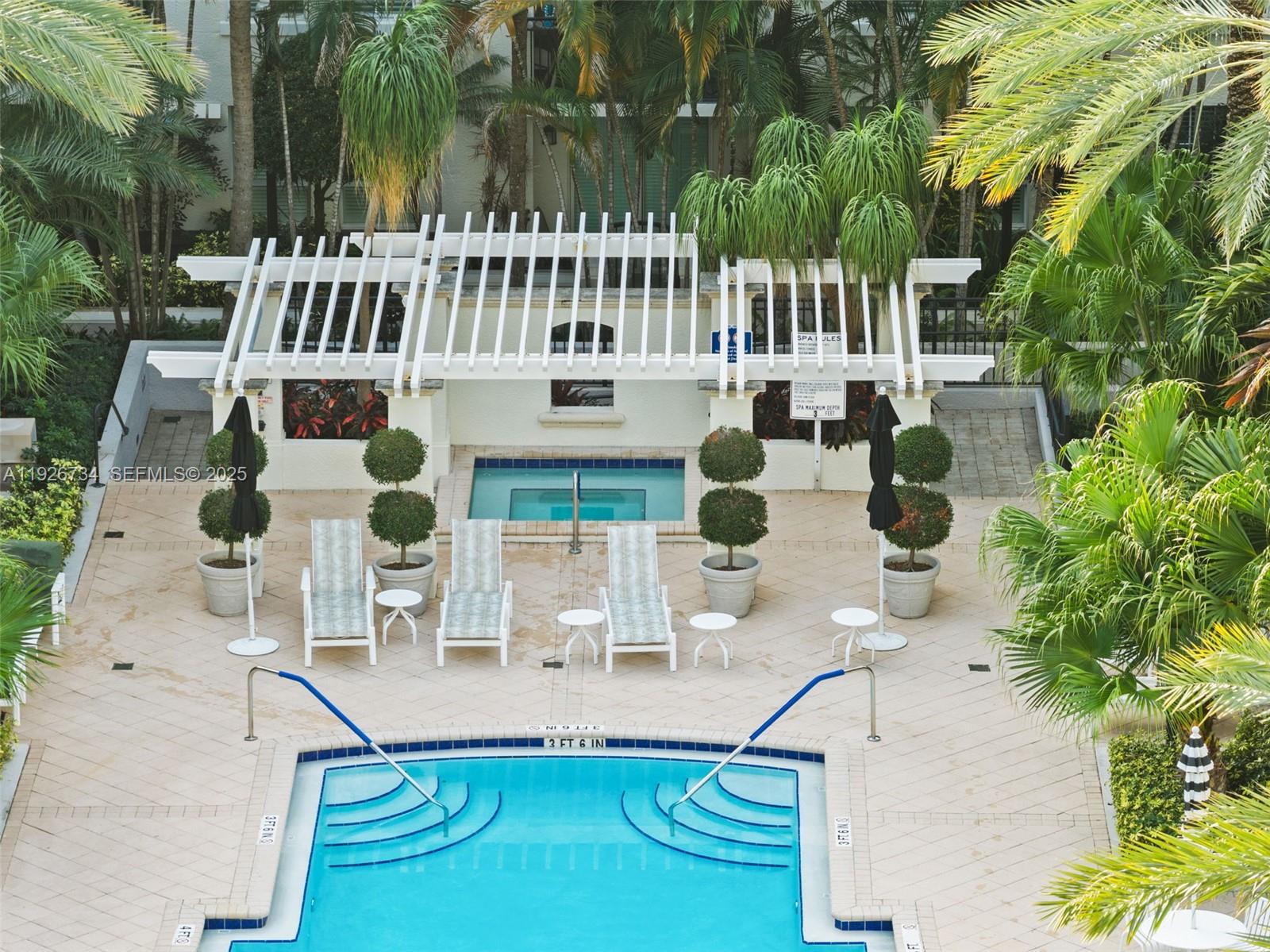 600 South Dixie Highway, Unit 237 West Palm Beach, FL 33401 - Photo 33 of 46 a view of building with swimming pool and bench