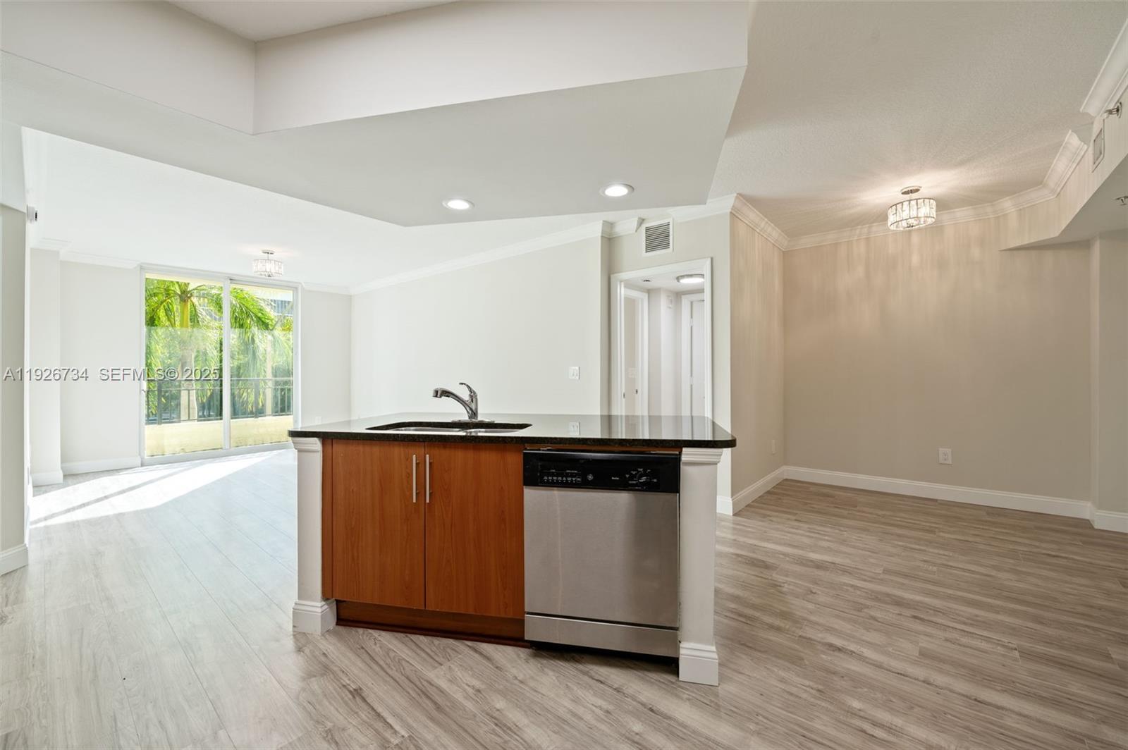 600 South Dixie Highway, Unit 237 West Palm Beach, FL 33401 - Photo 37 of 46 a kitchen with stainless steel appliances granite countertop a stove and a sink