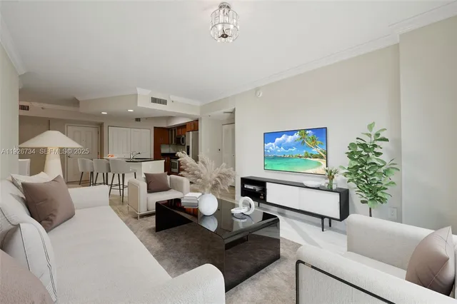 a kitchen with cabinets stainless steel appliances and wooden floor