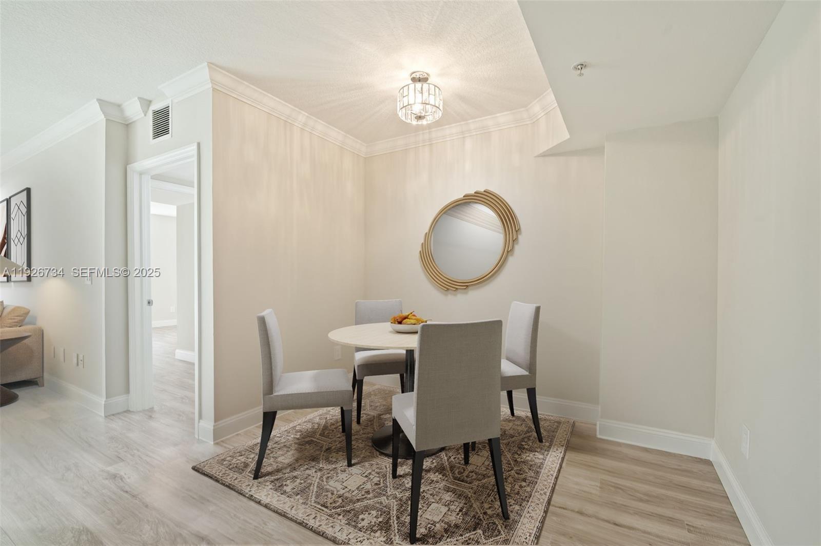 600 South Dixie Highway, Unit 237 West Palm Beach, FL 33401 - Photo 10 of 46 a view of a dining room with furniture and wooden floor
