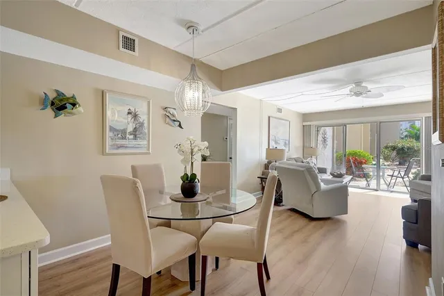 a living room with furniture a large window and a flat screen tv