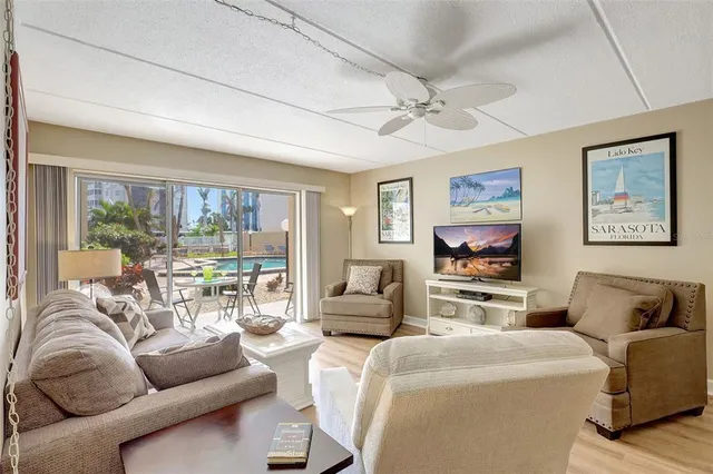 a bedroom with two beds and a chandelier