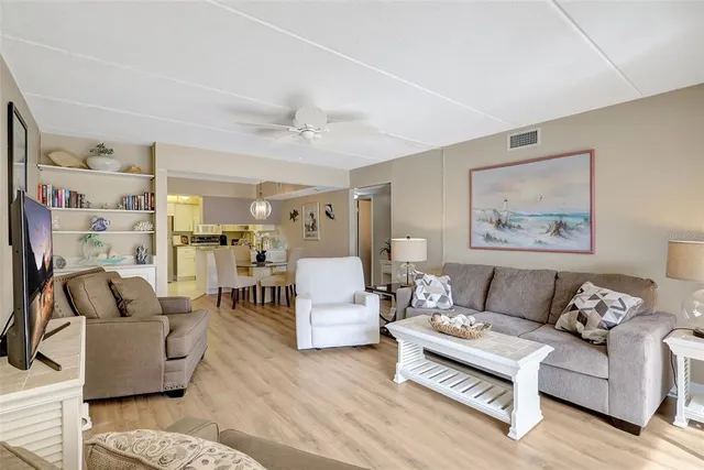 a bedroom with two beds and a large window