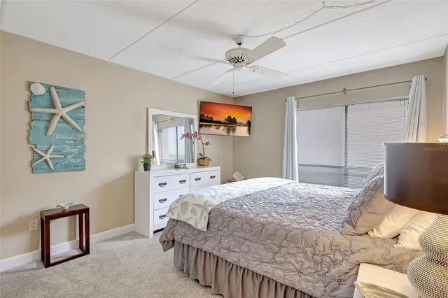 a kitchen with a sink cabinets and window