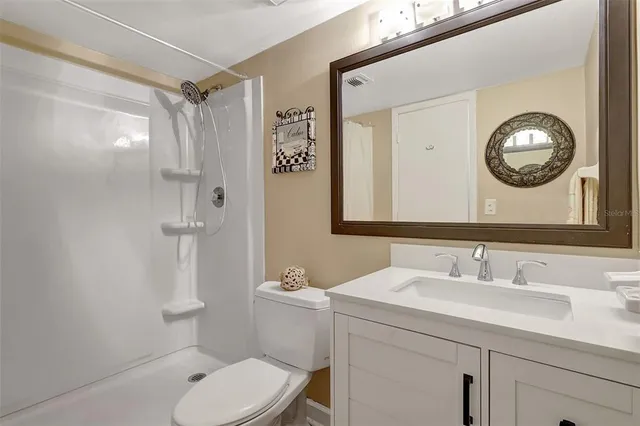 a kitchen with a white cabinets and white appliances