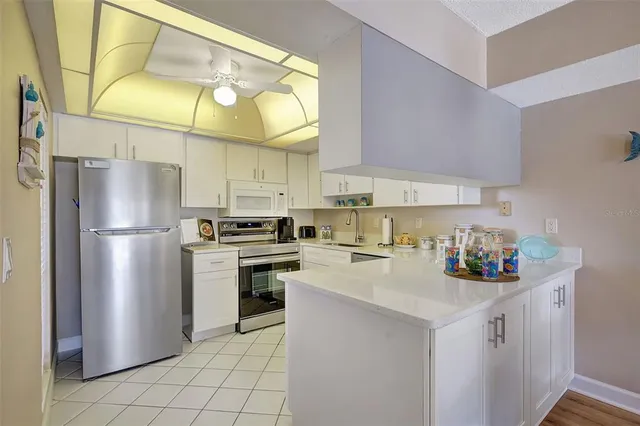 a view of a house with a flower garden