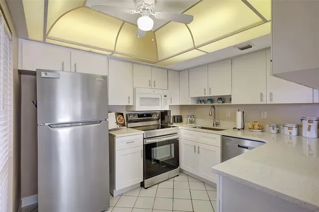 a view of balcony with wooden floor and fence