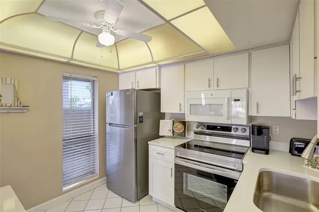 a view of balcony with wooden floor and fence